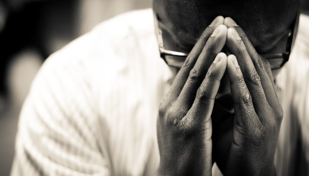 Man-In-Prayer-Christian-Stock-Photo